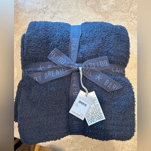Barefoot dreams blanket. Black Brand new, never opened. 54”-72”